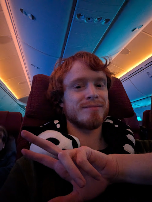 Me looking happy in my plane seat, right after I left